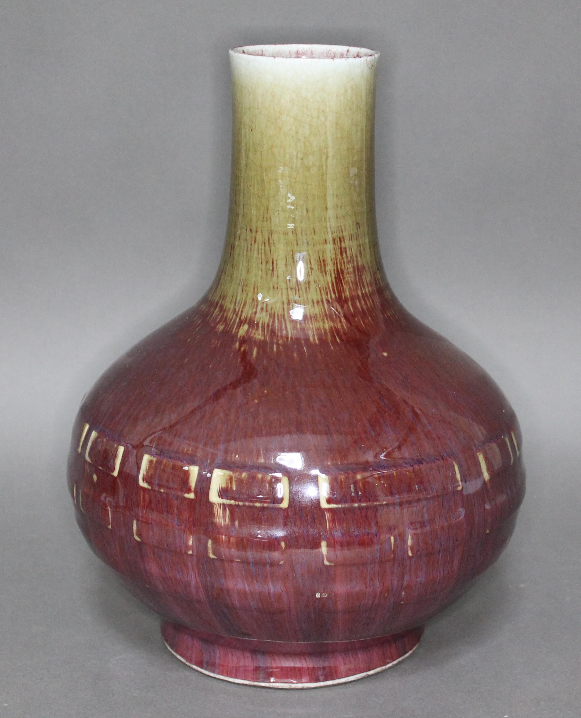 A Chinese Sang Du Bouf vase, 19th century, bottle form with geometric mouldings to body, flambe