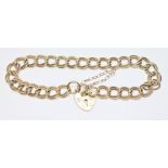 A hallmarked 9ct gold bracelet with heart shaped padlock clasp, length 15.5cm, wt. 11.9g.