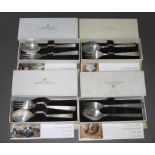 Four boxed Georg Jensen Sterling silver Christmas spoon and fork sets, comprising years 1968, 69, 70