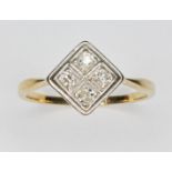 An Art Deco style dour stone diamond ring, the square cluster measuring approx. 7.68mm x 7.62mm,