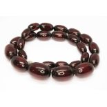 A graduated marbled cherry bakelite bead necklace, the beads ranging in length from approx. 12mm