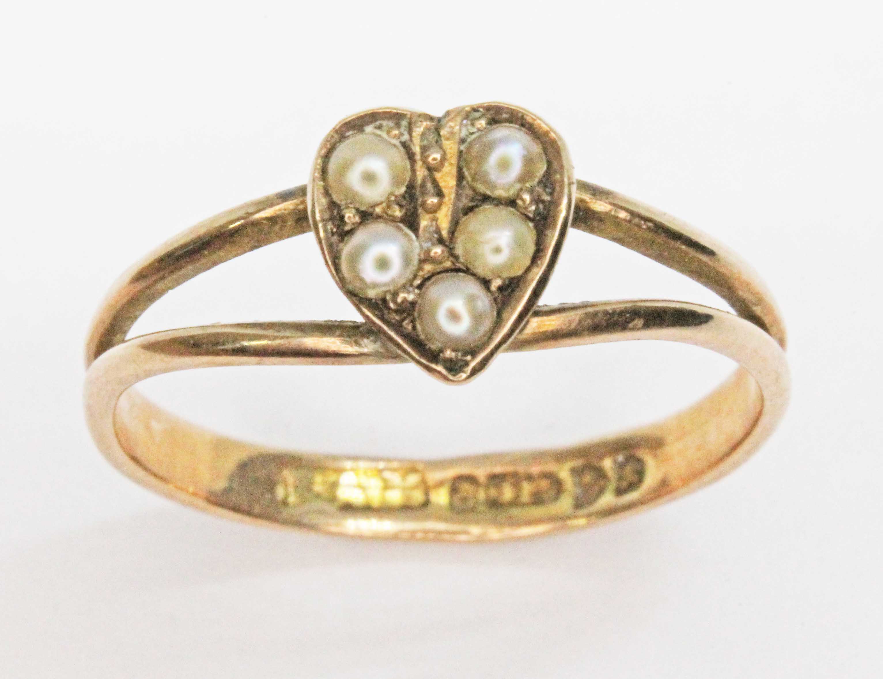 A late Victorian/Edwardian seed pearl heart cluster ring, hallmarked for Edwin Alfred Marsh, Chester