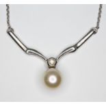 A hallmarked 9ct white gold diamond and cultured pearl necklace, length 48cm, gross wt. 5g.