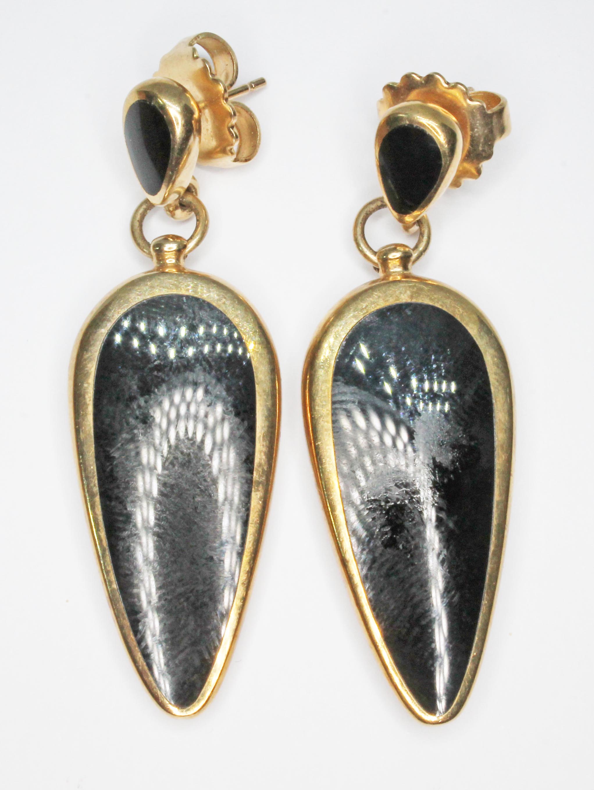 A pair of hallmarked 9ct gold and black onyx drop earrings, length 48mm, gross wt. 13g.