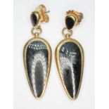 A pair of hallmarked 9ct gold and black onyx drop earrings, length 48mm, gross wt. 13g.