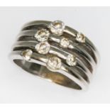 A diamond cluster ring, eight random set round brilliant cut diamonds weighing approx. 0.36cts in