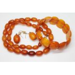 Butterscotch pressed amber jewellery comprising a graduated bead necklace, the oval beads ranging in