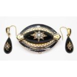 A mid 19th century suite of black enamel and pearl mourning jewellery comprising a marquis shaped