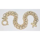 A fancy link bracelet with bolt ring clasp, marked '374', length 18cm, wt. 13.4g.