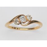 An antique three stone diamond ring, the old cut stones weighing approx. 0.36cts in total,