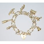 A hallmarked 9ct gold charm bracelet, length 14cm, gross wt. 12.9g.