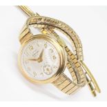 A ladies 9ct gold Enicar wristwatch, case diameter 22mm, signed champagne dial, seconds