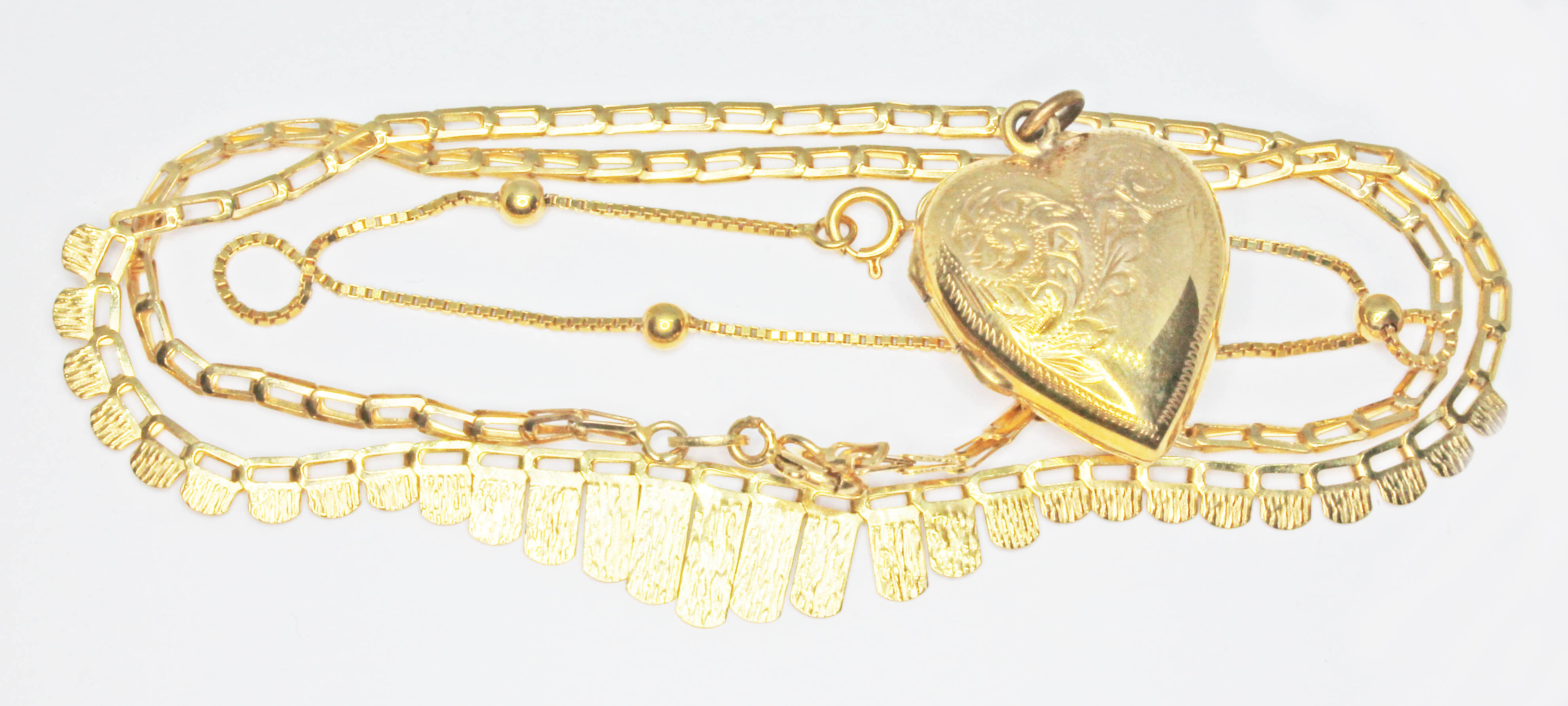 A mixed lot comprising a fringe necklace and bracelet, both with 9ct gold import marks, together