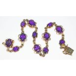 A hallmarked 9ct gold amethyst bracelet, length 18cm, gross wt. 10.6g.