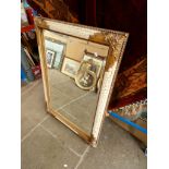 A modern cream and gilt framed wall mirror, 106cm x 76cm.