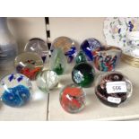 12 glass paperweights including Isle of Wight glass, Caithness etc