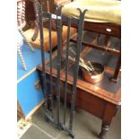 A French wrought metal kitchen rack and set of copper and brass pans.