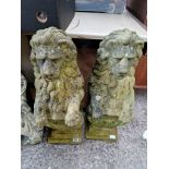 A pair of stoneware garden lion statues, 77cm height.