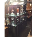 Various items of modern furniture including glass top sideboard, black and chrome coffee table,