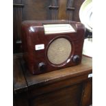 A vintage Bush bakelite radio, serial number 10/33548.