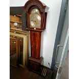 A mahogany cased grandmother clock, complete with weights and pendulum.