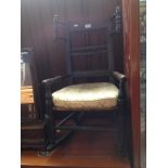 A 19th century child's Lancashire rocking chair with rush seat.