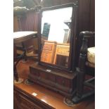 A Georgian walnut and mahogany toilet mirror.