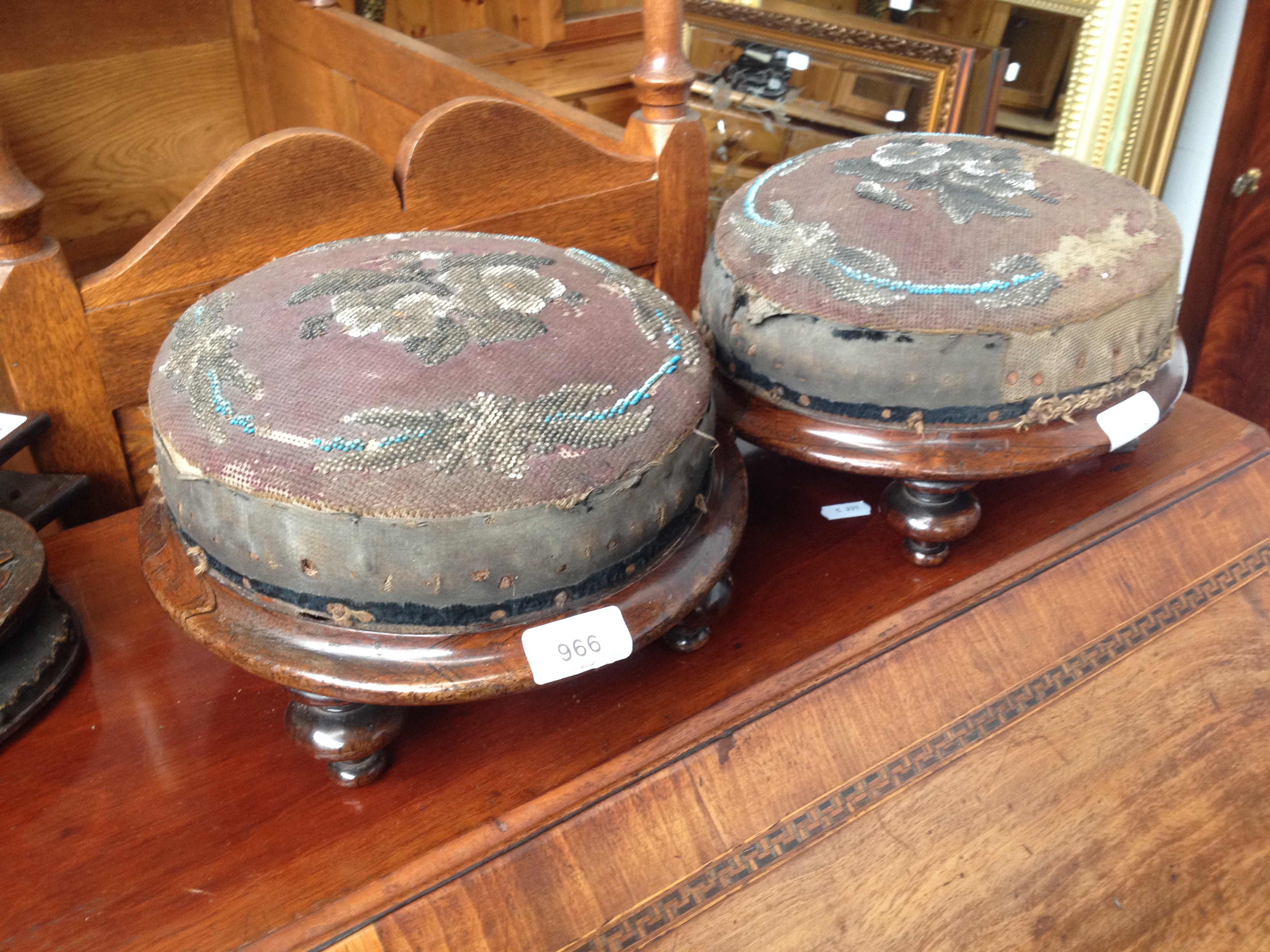 A pair of Victorian rosewood and bead work footstools.