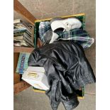 A box to include al ladies wig, golf shoes, tartan skirt, leather jacket, 2 fur jackets, stole etc