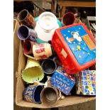 A box of mixed ceramics etc including a number of advertising mugs, many by Cadbury