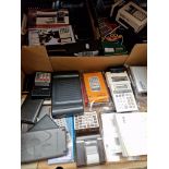 Three boxes of vintage calculators.