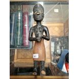 A primitive African carved wooden figure
