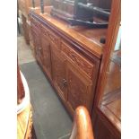 A Chinese carved hardwood sideboard, length 152cm.