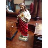 A vintage plaster figure of Jesus and the Sacred Heart, inscribed with 'CR' monogram to rear, height