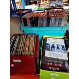 A box of 45s and a box of ABBA DVDs and CDs