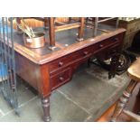 A Victorian mahogany desk with adjustable writing surface, width 120cm.