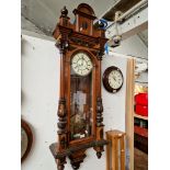 A large walnut cased Vienna wall clock.