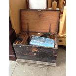 An antique joiner's tool chest containing a number of vintage hand tools, saws etc.