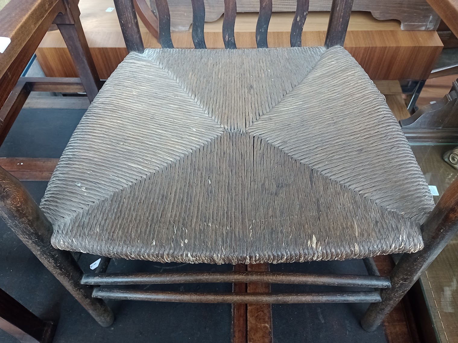 An Arts & Crafts ebonised and rush seat chair together with an Edwardian adjustable piano stool. - Image 3 of 3