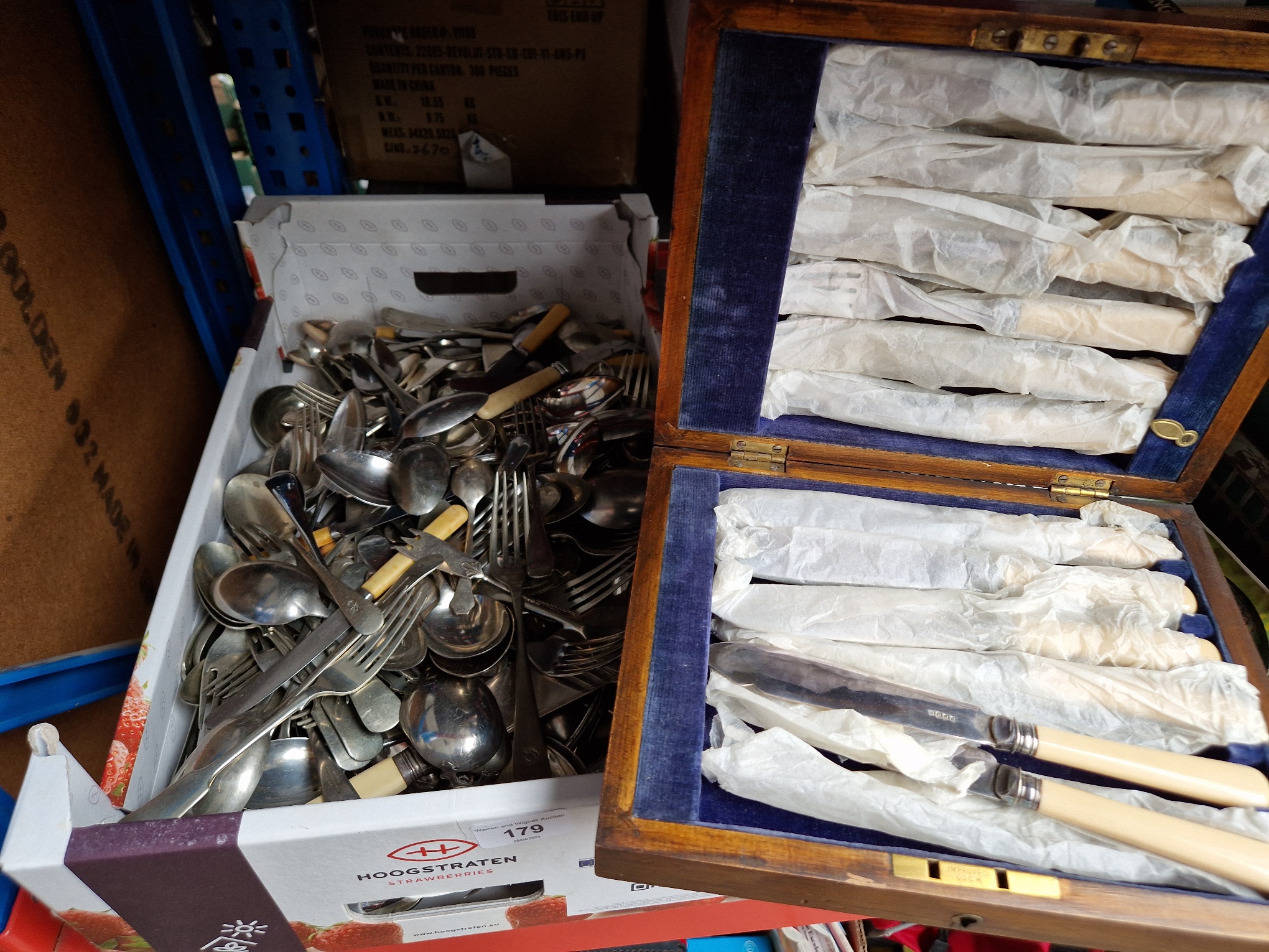 A box of mixed cutlery and a cased set of fish knives and forks