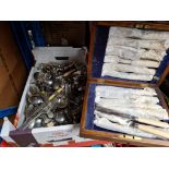 A box of mixed cutlery and a cased set of fish knives and forks