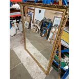 A large gilt framed mirror, 99cm x 127cm.