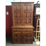 A late Victorian/Edwardian stained beech cabinet bookcase with panelled doors, reclaimed from a
