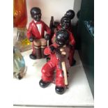 A four piece ceramic jazz band, height 18cm (approx).