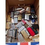 A collection of 45 various cigarette lighters.