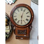 A 19th century rosewood cased Ansonia wall clock, inlaid with white metal and mother of pearl.