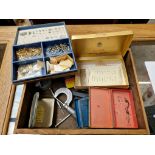 A box of assorted watch parts.