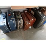 6 suitcases, (2 leather, 1 soft material and 3 hard shell) and a cabin trunk