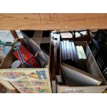 A box of pictures and advertising mirrors, and a box containing jigsaws, toys, posters etc