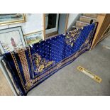 A large Turkish carpet, blue ground 275cm x 192cm.